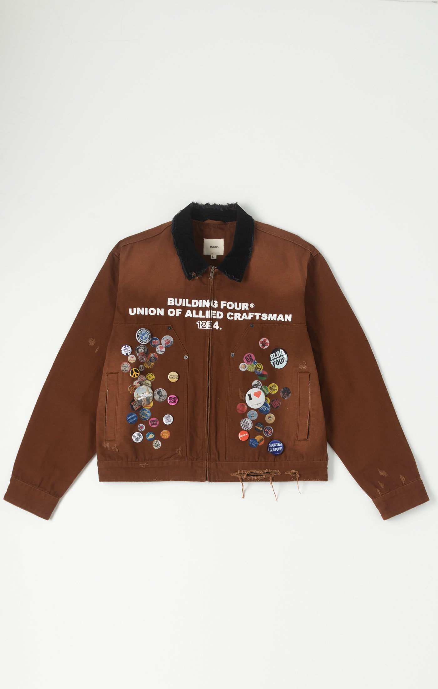 BLDG4 Brown jacket with colorful pibs and text on a white background